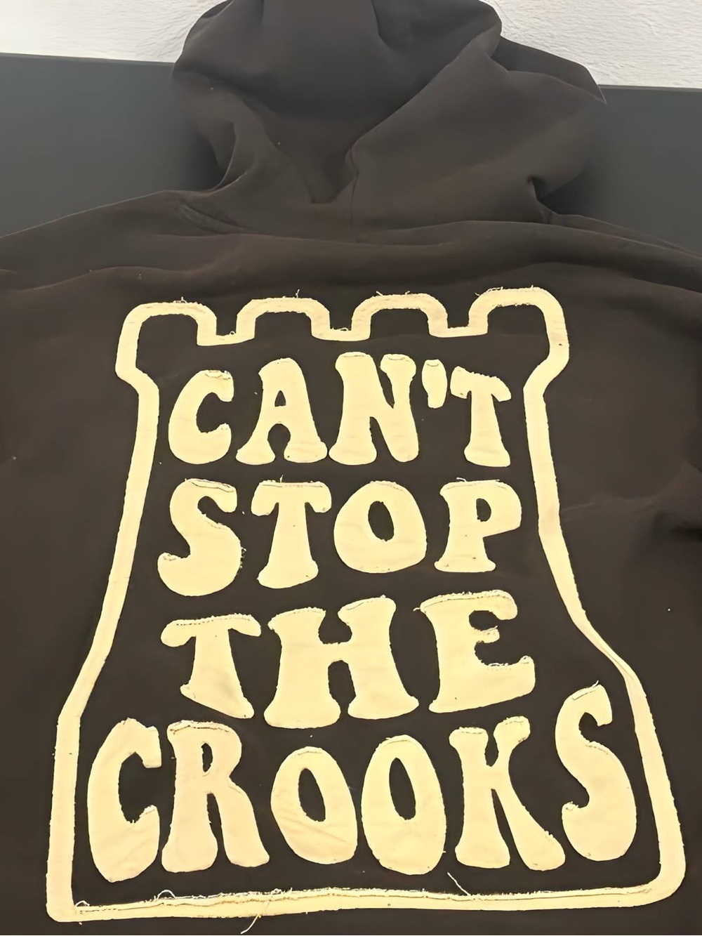 Black Graphic Hoodie with Cream 'Can't Stop The Crooks' Print